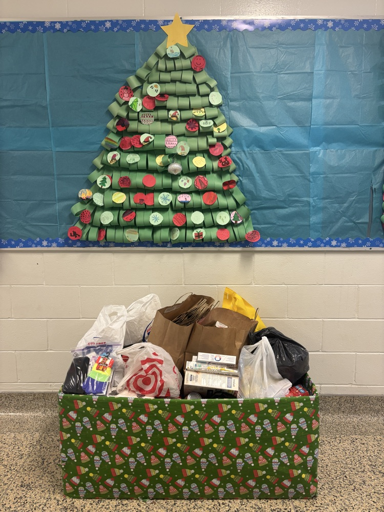 box of donations and paper tree decoration 