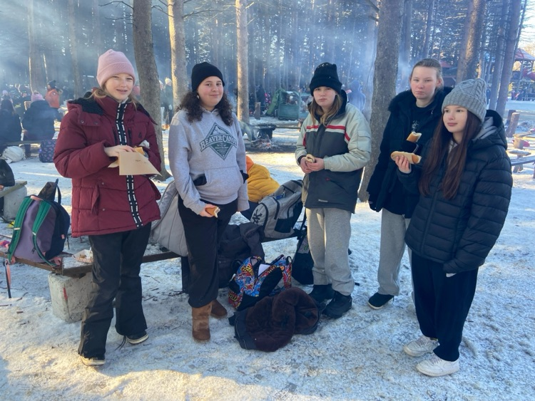Students at a tree farm in the winter