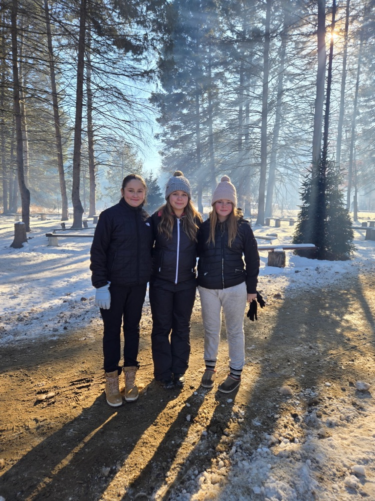 Students at a tree farm in the winter