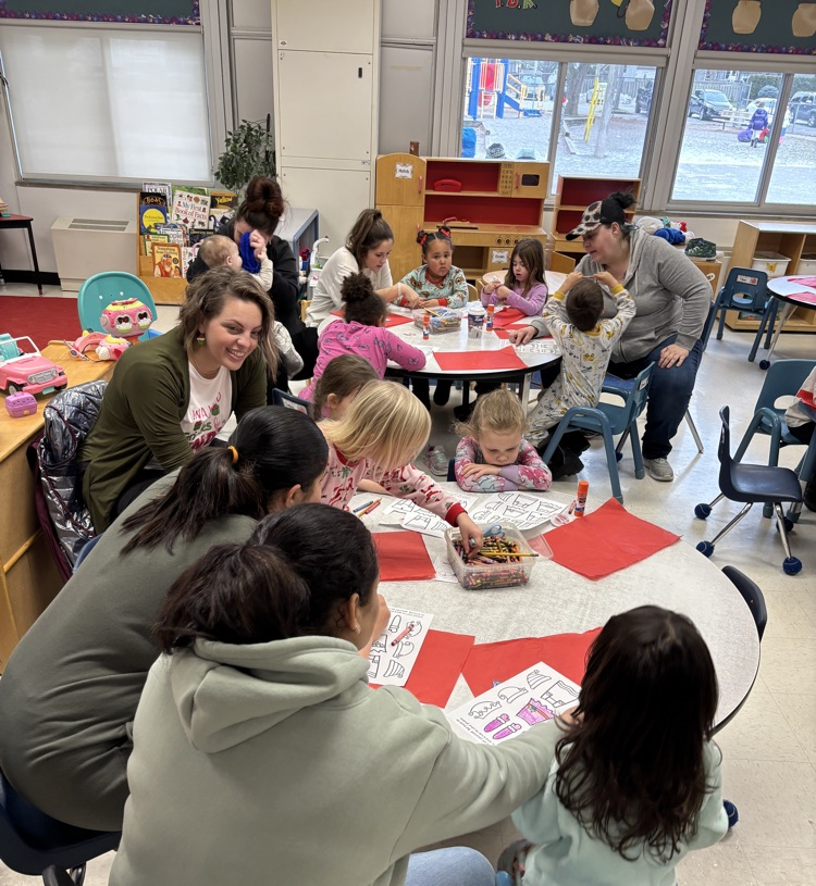 parents doing crafts with their student students in a kindergarten