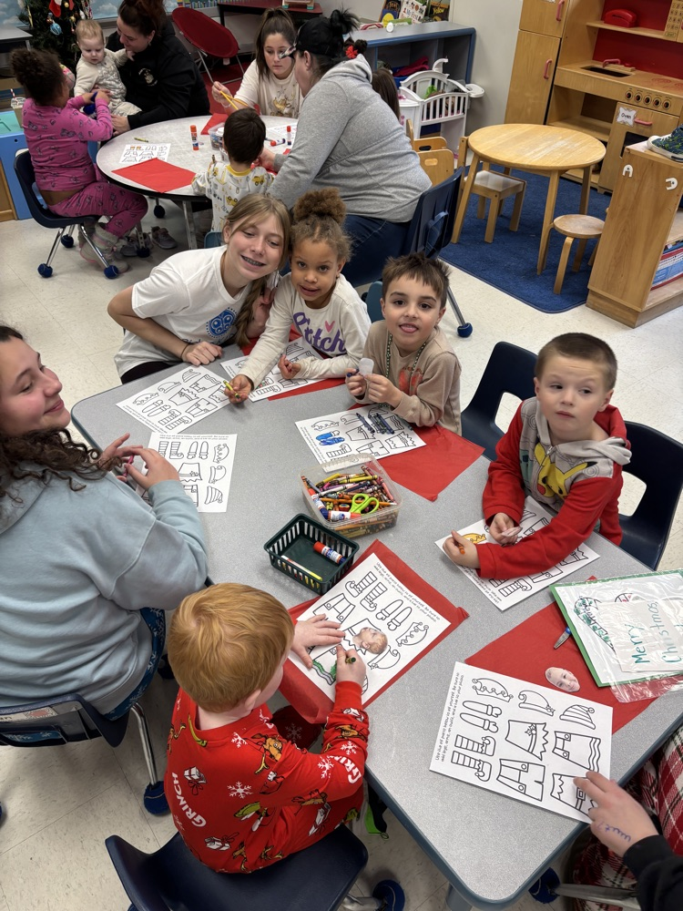 Parents doing crafts with their students in a kinder