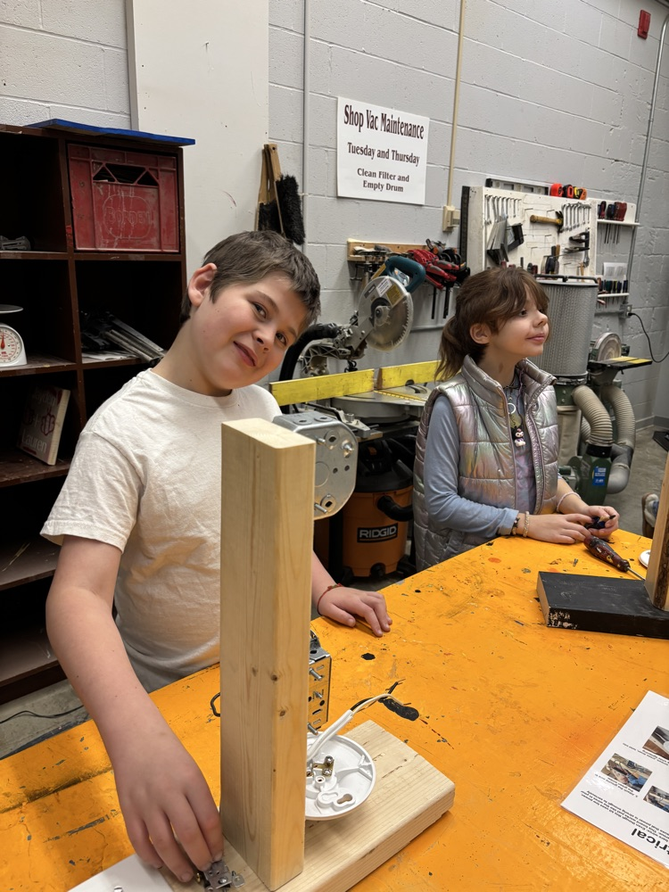 Students wiring a switch to a lightbulb