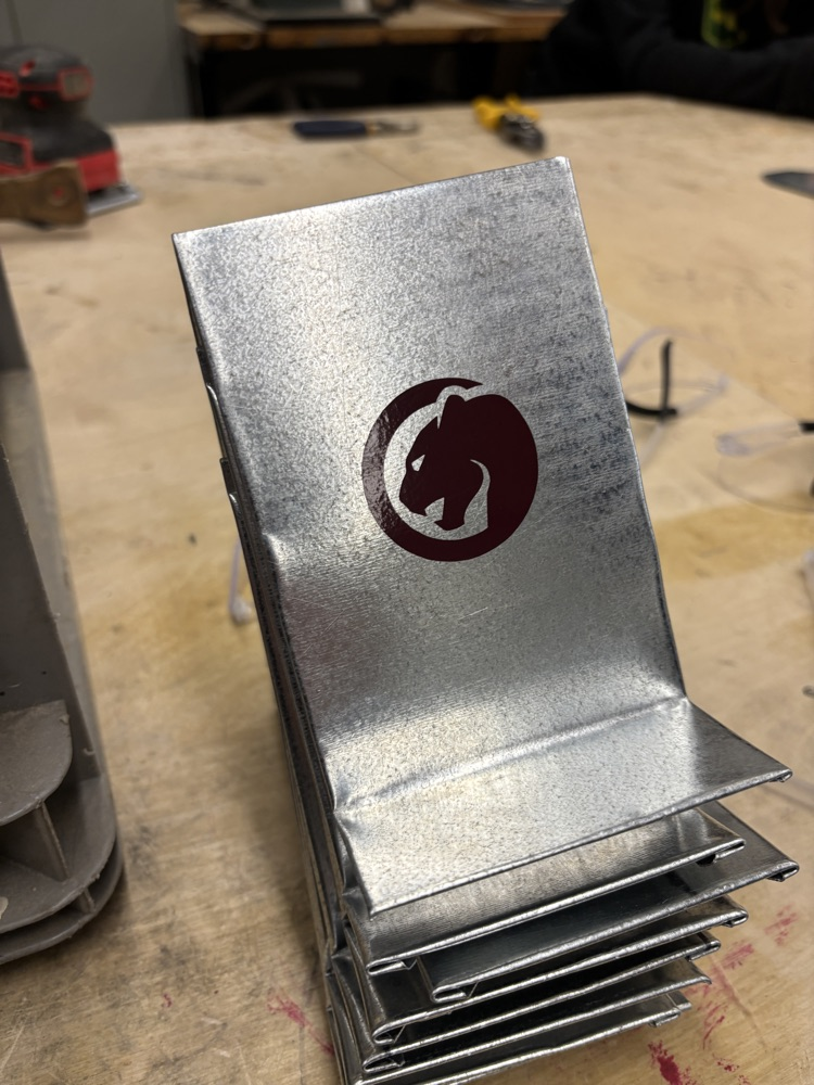 Sheet metal folded into a phone holder