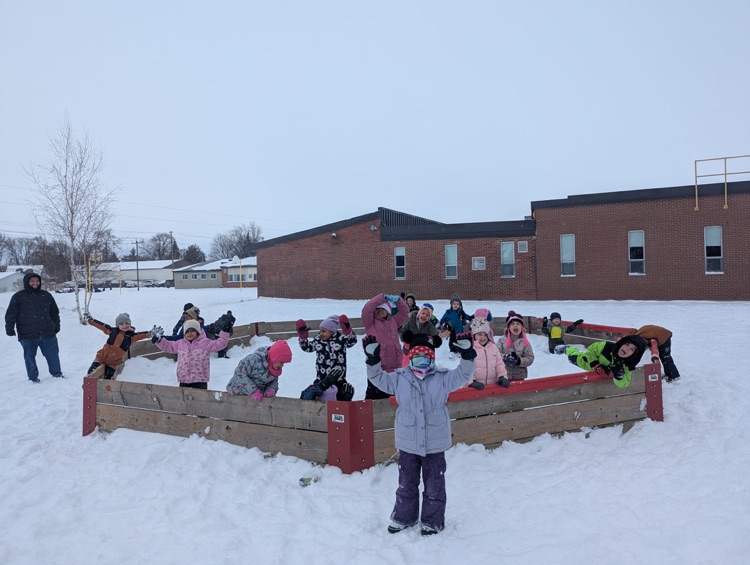 Children playing in the snow in the gag ball pit