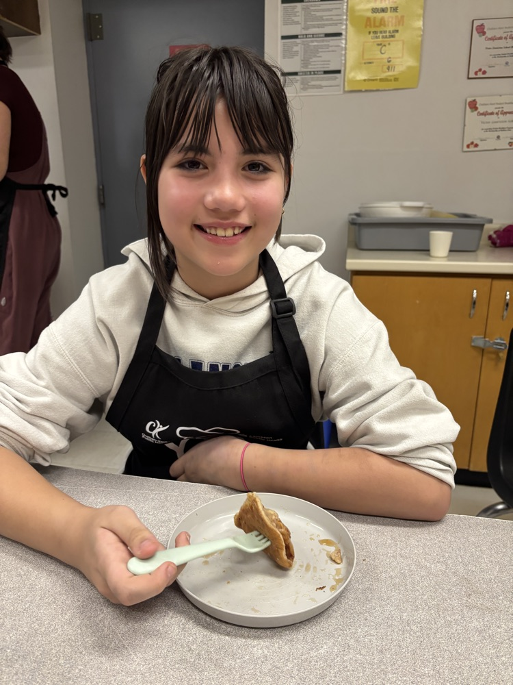 Student eating a pancake