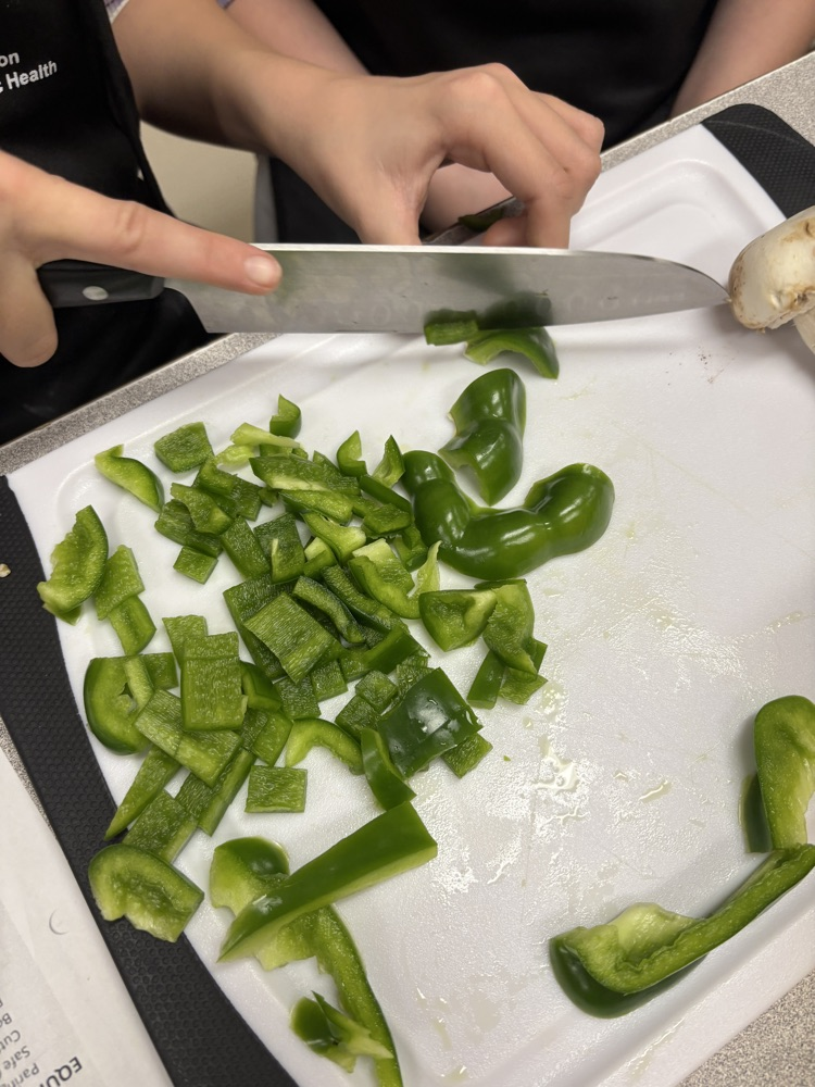 Chopped green peppers on a cutting