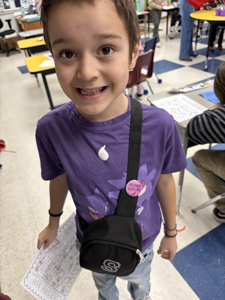 student wearing his button