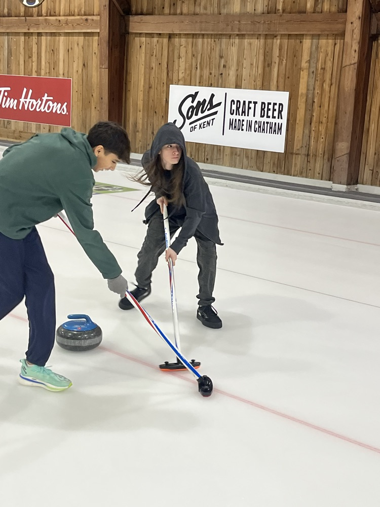 students curling at the Chatham Granite club