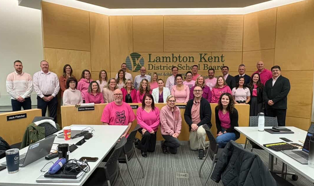 Admin Council Members posing in pink attire.