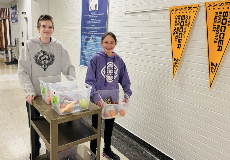 students delivering bins