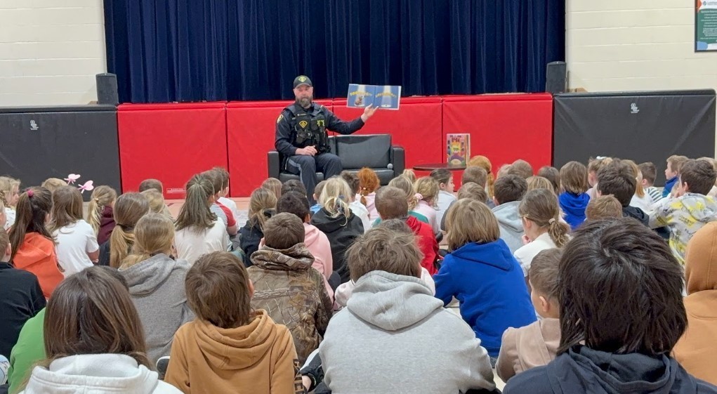 Officer Campbell kicking of March Madness at Riverview Central!