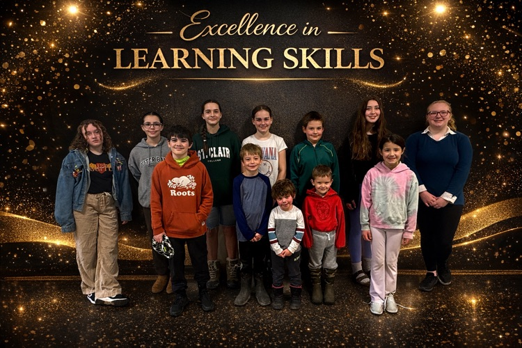 group of 12 students smiling at the camera with a background that says - Excellence in Learning Skills