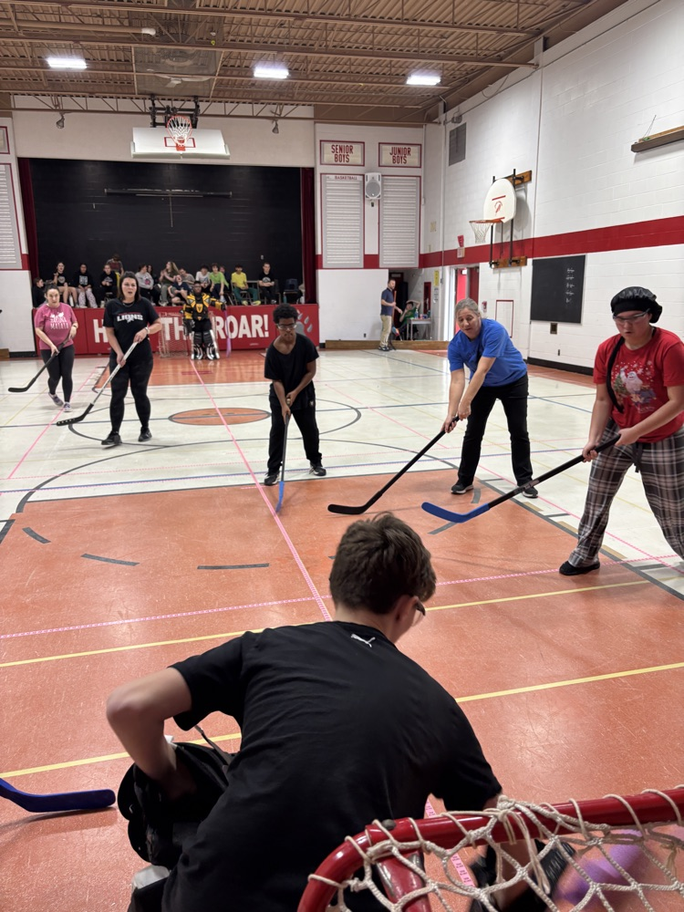 people playing floor hockey