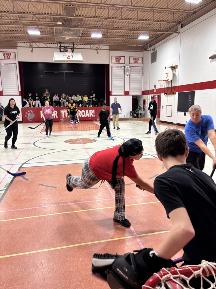 people playing floor hockey