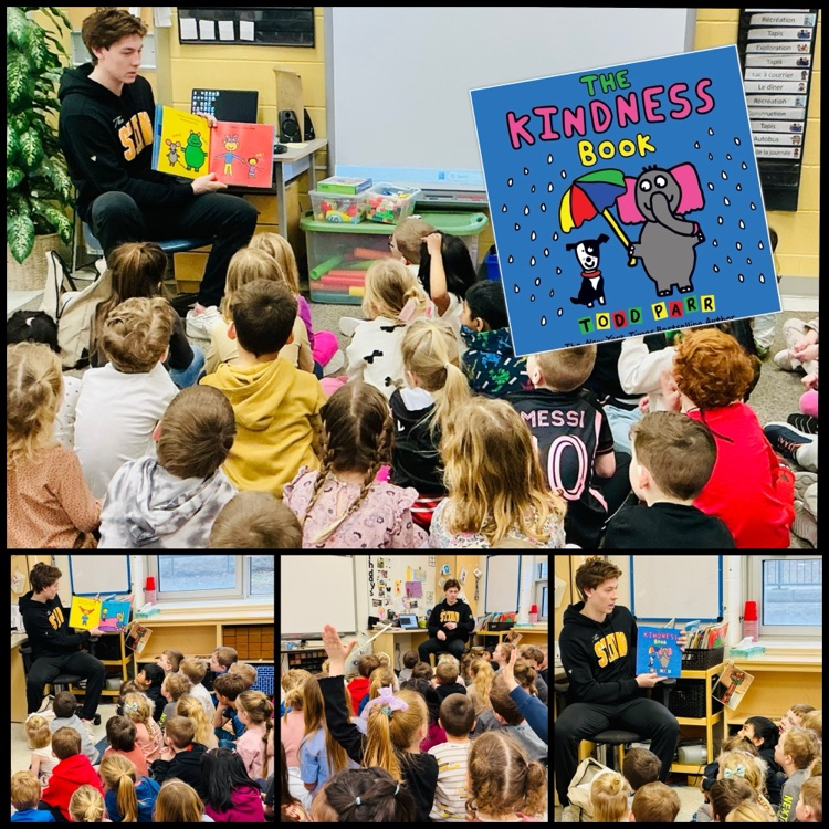 hockey player reading a book to children