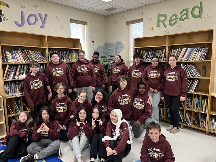 Students gathered together wearing matching hoodies for the upcoming school trip to Muskoka