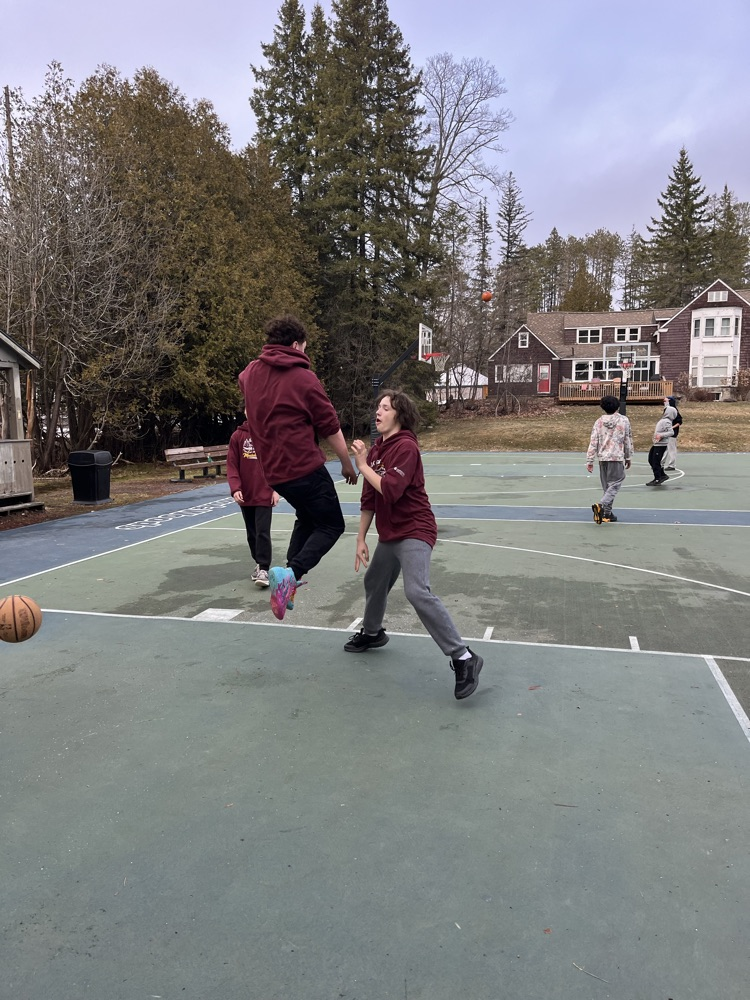 Students playing basketball