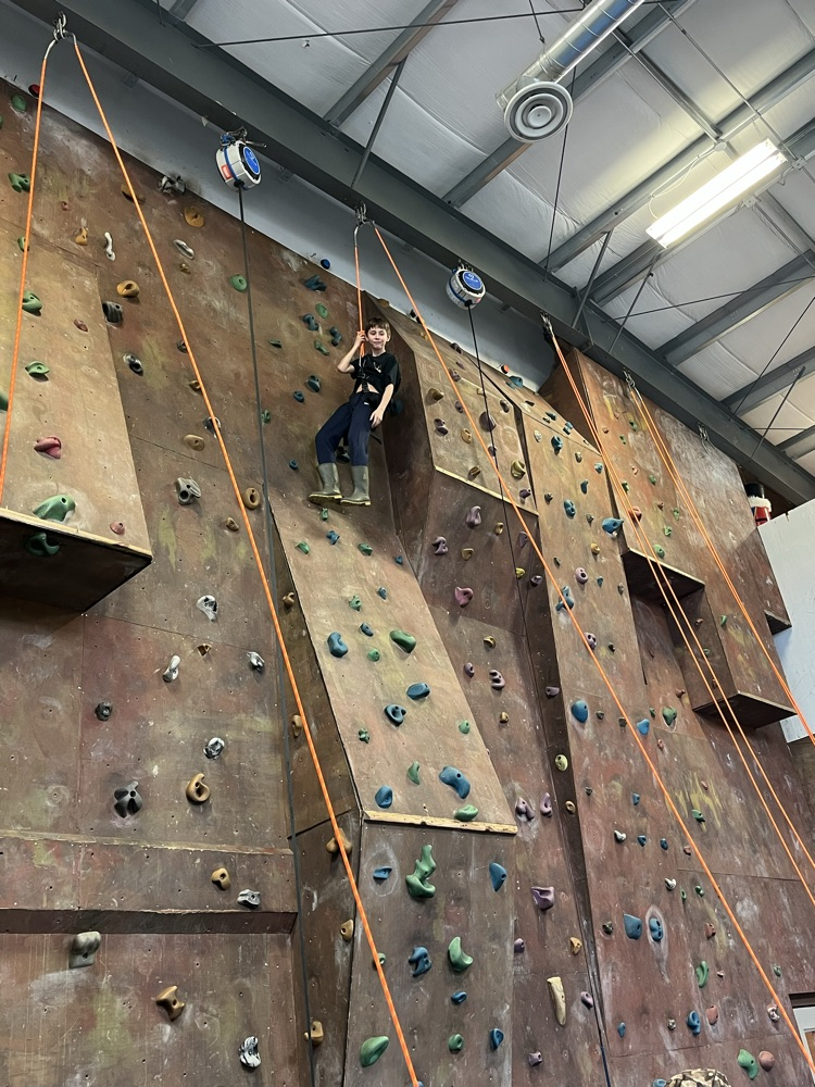 Student on rock climbing