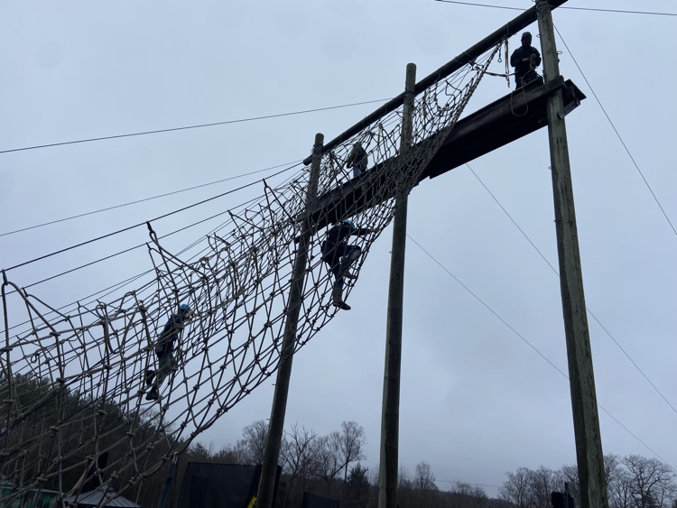 Students on high rope course giant