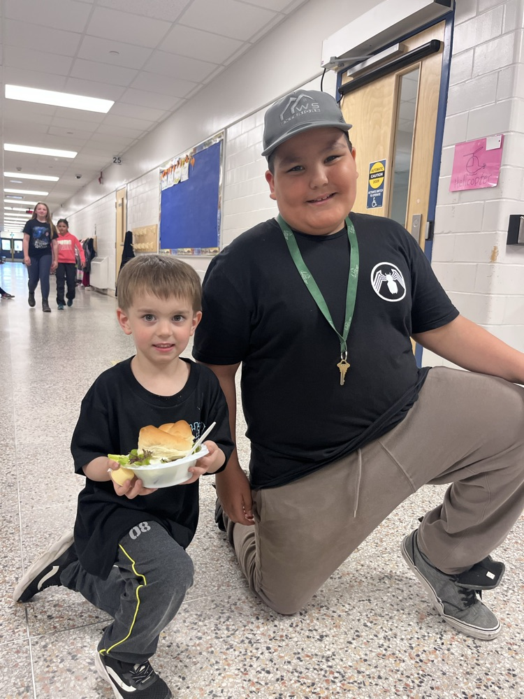 Students holding food 