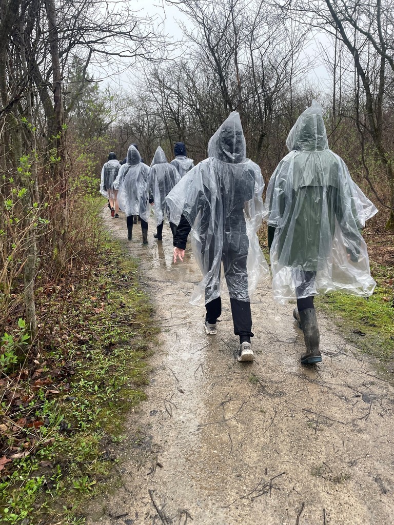 Students with ponchos learning and beginning the healing walk