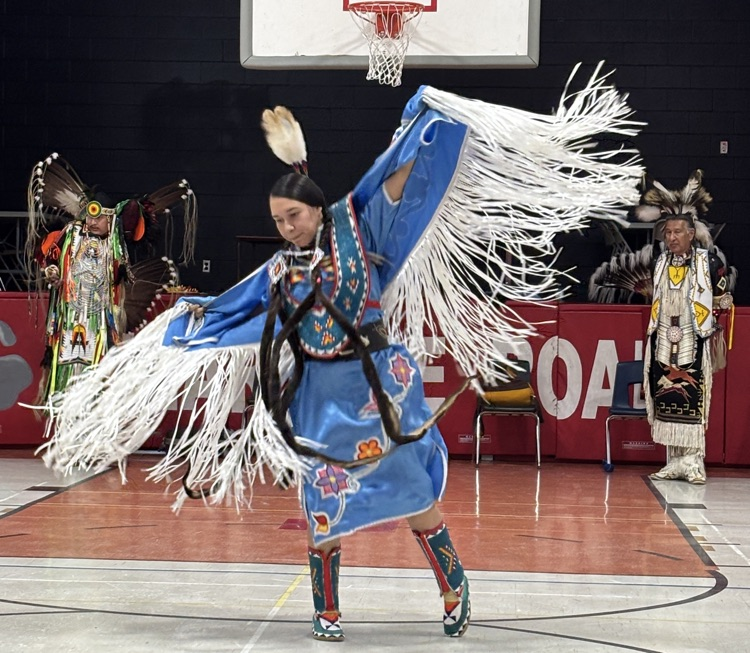 Indigenous female dancer in full regalia