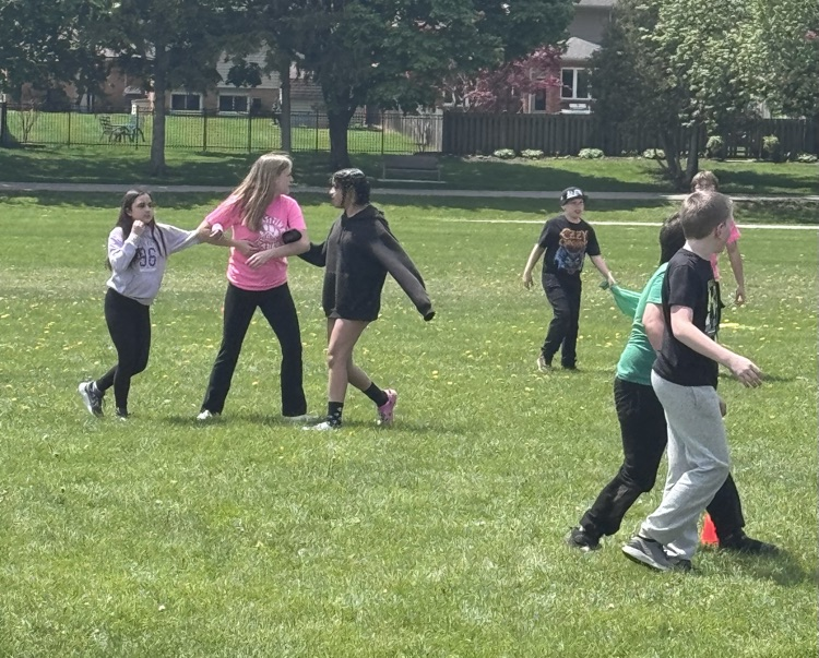 Children running around to sports field