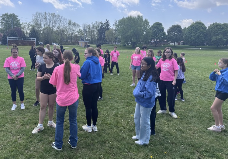 Children gathered to play a game in a sports field