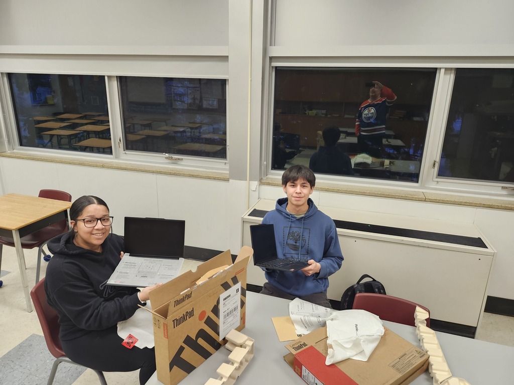 Mya and Blake opening their computers