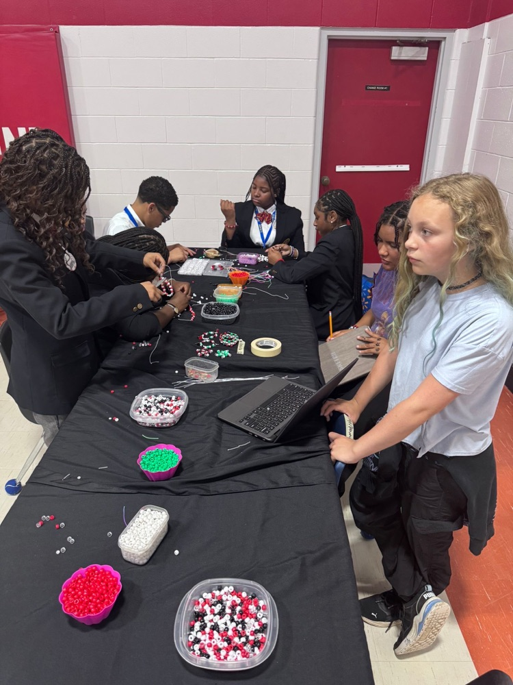 Students making friendship bracelets