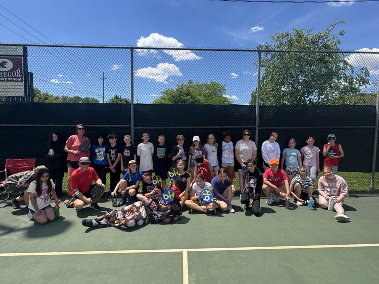 students gathered on the Pickleball court