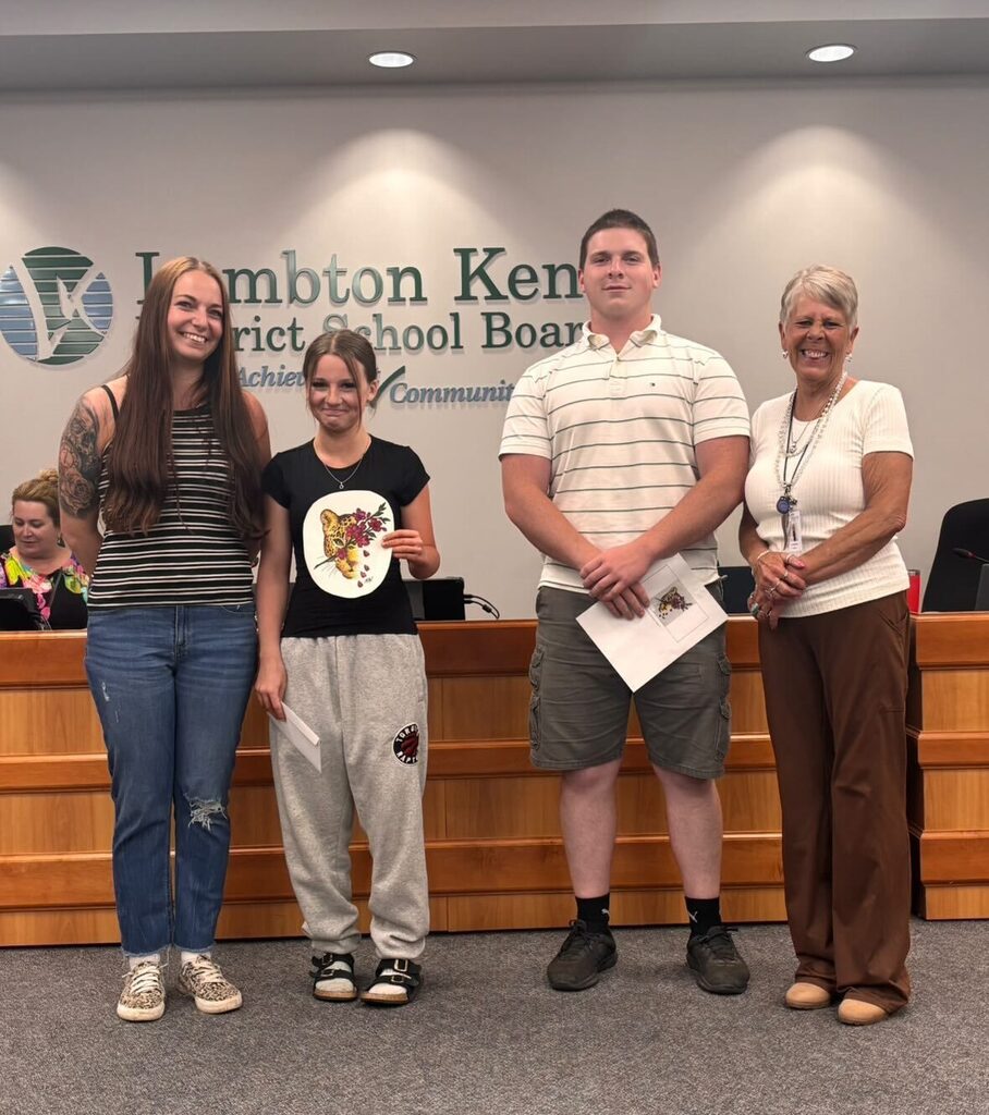 Student artists pose with Trustee and Student Trustee 
