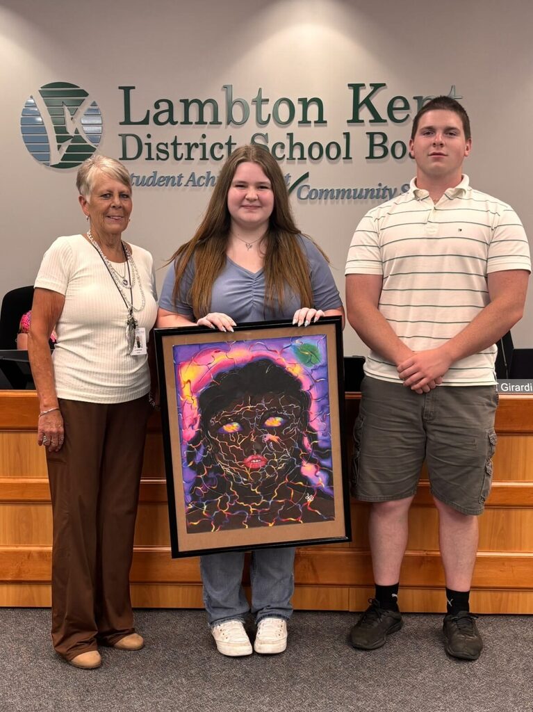 Student artists pose with Trustee and Student Trustee 