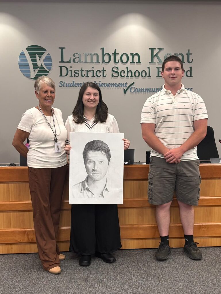 Student artists pose with Trustee and Student Trustee 