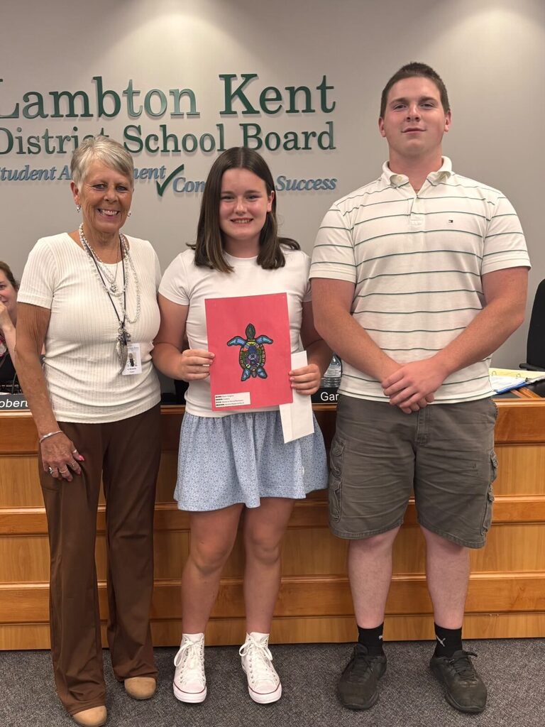 Student artists pose with Trustee and Student Trustee 