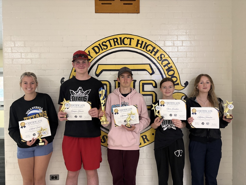 5 students holding certificates and trophies 
