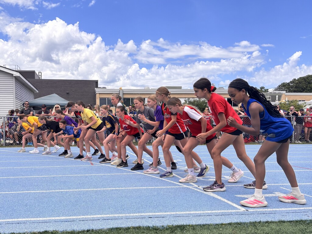 Student Athletes line up to start race at track meet.