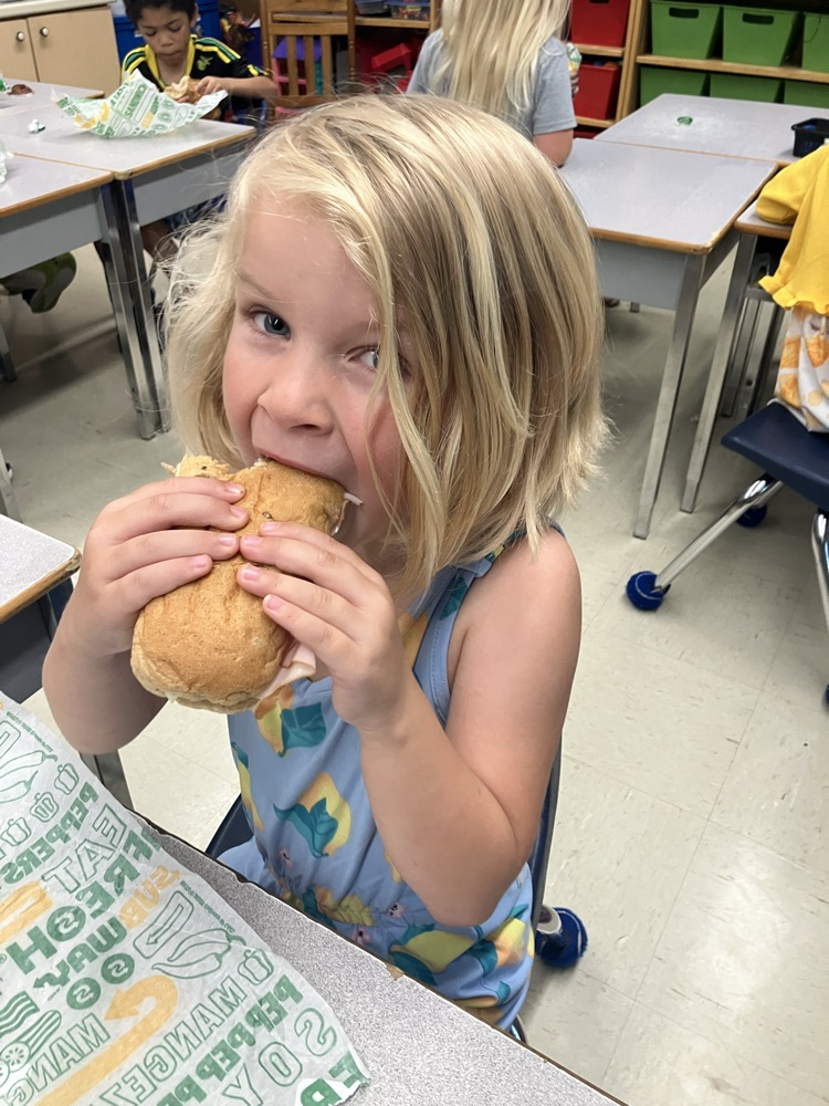 Student eating a sub