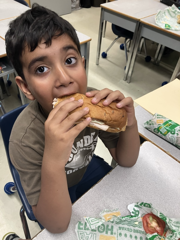 Student eating a sandwich