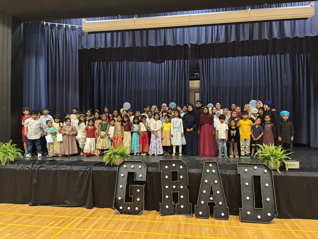 IILE Graduation Students on stage at 2026 grad event