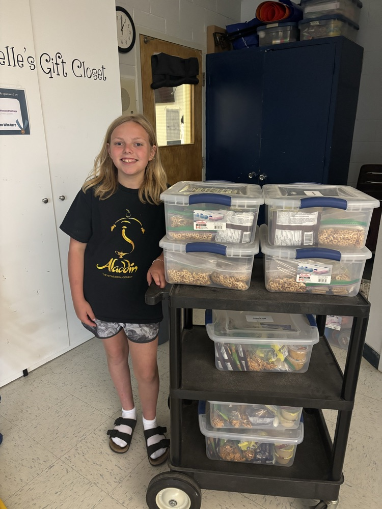 student with food bins 