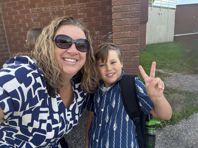 a male student smiling at the camera with Mrs V