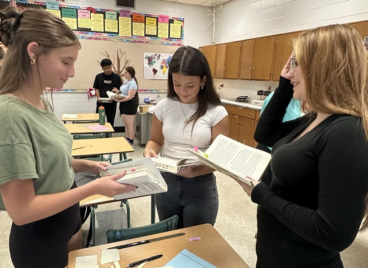 ENG4U students discussing their thoughts and connections after reading