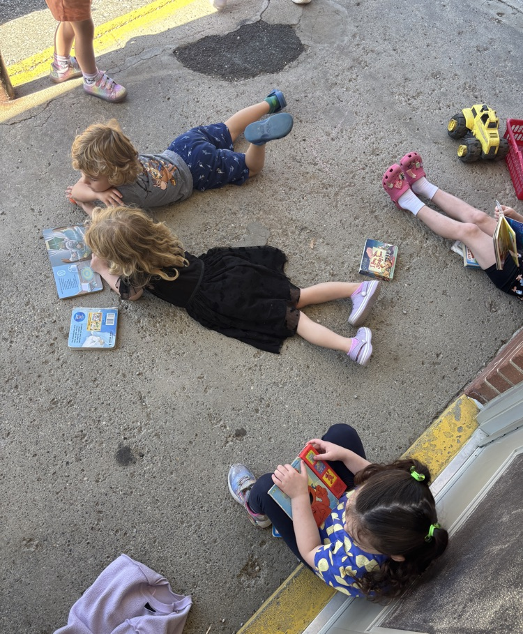 students reading outside