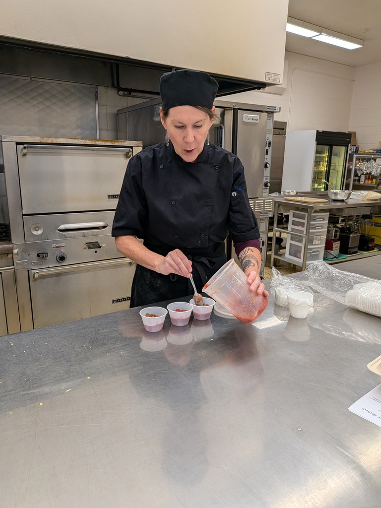 Mrs. Ward serving the salsa made by her Hospitality classes