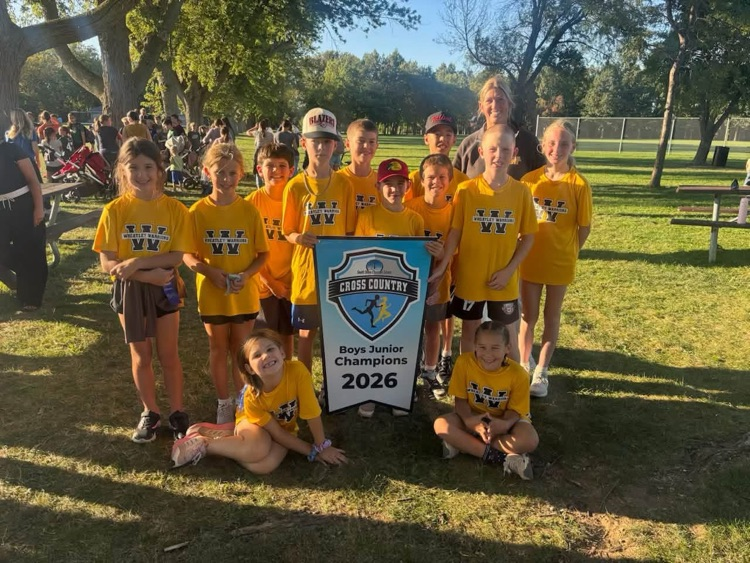 Team Wheatley cross country runners holding a banner