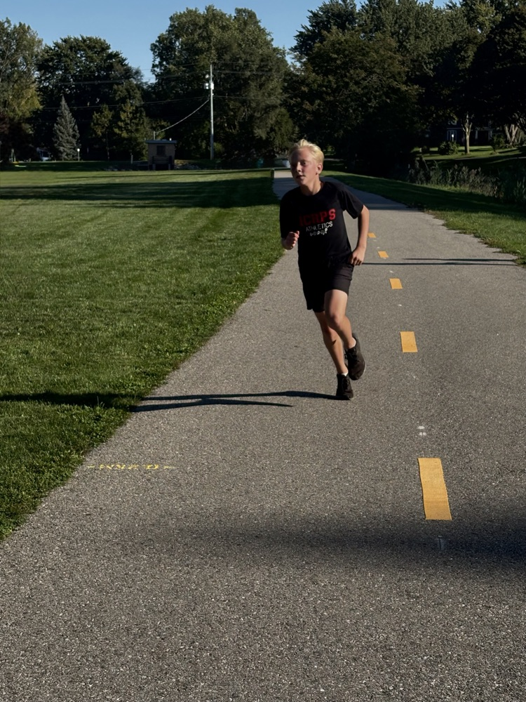 Young man running down the path at Mud Creek.
