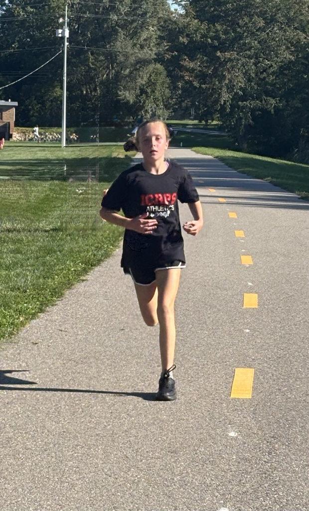 Young girl running down the path at Mud Creek.