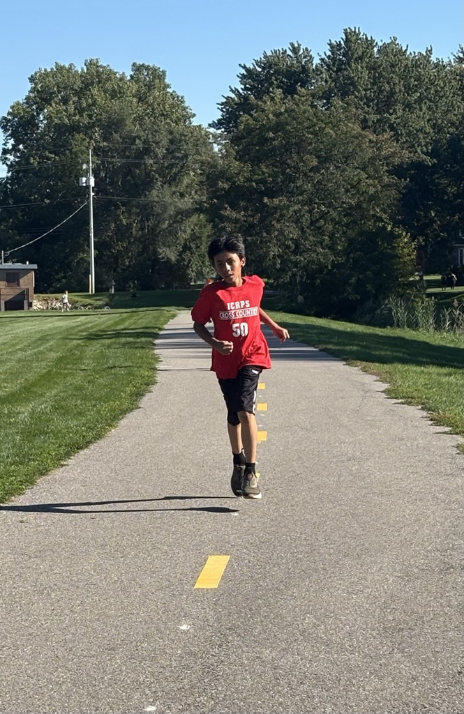 Young boy running down the path at Mud Creek.