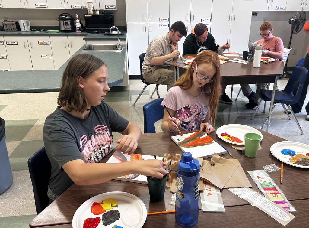 Students working on their paintings.